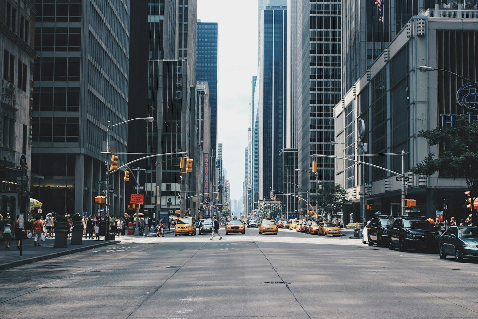 A street between tall city buildings